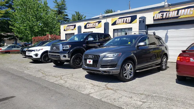 Lineup of customer vehicles at the Steam Green Auto Detail shop