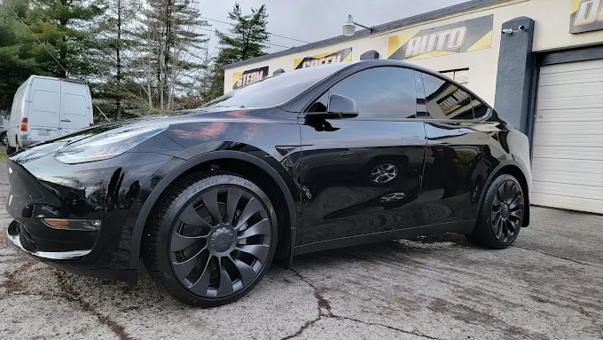 Black Tesla Model Y after a complete exterior detail