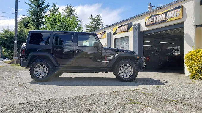 Black Jeep Wrangler Rubicon outside Steam Green Auto Detailing